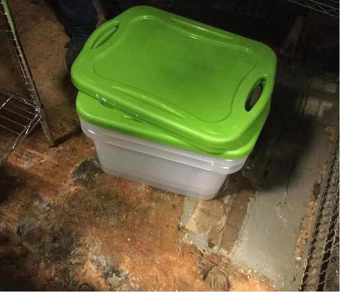 green storage box basement floor