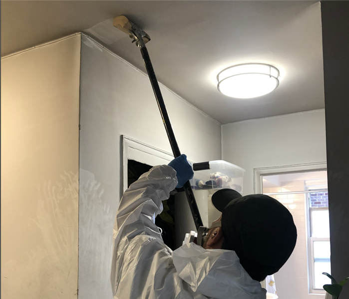 Soot on walls being cleaned up